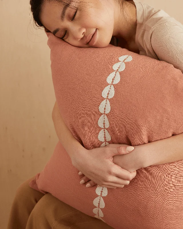 cowrie embroidered pillow in sandalwood